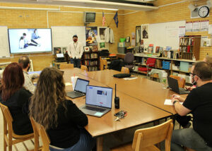 Teachers watch Esai Present